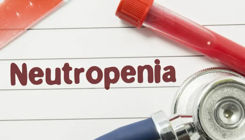 Badanie krwi i stetoskop, słowo "Neutropenia" na papierze.